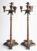A pair of French bronze four light candelabra, last quarter 19th century; each with a raised,
