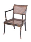 A Regency black lacquer and chinoiserie beechwood elbow chair, decorated with flowers,