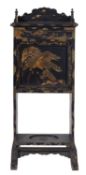 A late 19th Century Japanese black lacquer escritoire, decorated with trailing floral foliage,