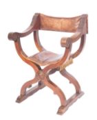An Italian walnut and leather Savanorola elbow chair in 16th century taste,