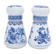 A pair of Chinese blue and white jars and covers of conical form with compressed globular covers,