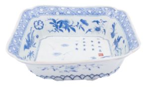 A Japanese blue and white pleated square-section bowl, late Meiji the well painted with a cockerel,