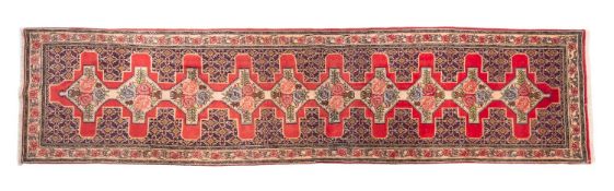 A Senneh runner, the rose stepped cruciform field with vases of roses,