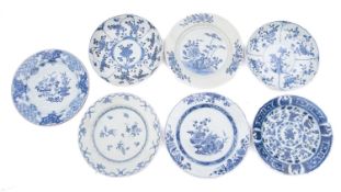 Seven Chinese porcelain plates, of circular form, each painted in blue with flowers,