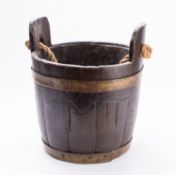 A Victorian oak and brass bound coal bucket, last quarter 19th century; of coopered construction,