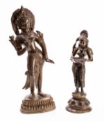 Two Indian bronze figures of deities, 20th century on lotus bases, 29 and 37cm.