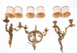 Three various gilt metal twin light wall appliques, in Louis XV style,