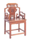 A Chinese stained hardwood elbow chair in 17th century taste,
