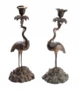A pair of Regency gilt bronze candlesticks in the manner of Thomas Abbott,