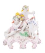 A Plymouth group of two putti with a goat the putti wearing garlands and drapery and holding a