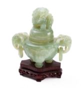 A Chinese carved green hardstone tripod censer and cover,