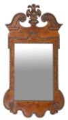 A carved walnut and burr walnut framed wall mirror in George II style, 20th century
