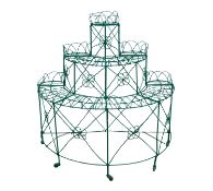 A wirework plant stand, early 20th century; of tiered demi-lune form and openwork throughout,