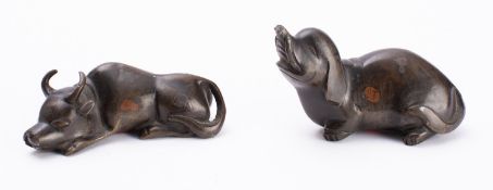 A small Chinese bronze figure of a reclining water buffalo and one similar of an elephant 17th/18th
