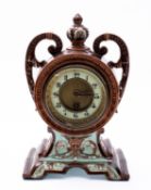 A Continental majolica mantel clock having a French eight-day duration timepiece movement with