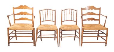 A pair of rush seated ash elbow chairs, in late 18th century taste,