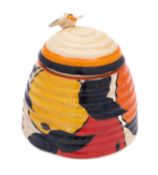A Clarice Cliff Beehive preserve pot and cover, enamelled in the Oranges and Lemons pattern,