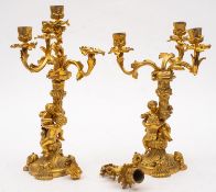 A pair of gilt bronze figural four light candelabra in Louis XV style,
