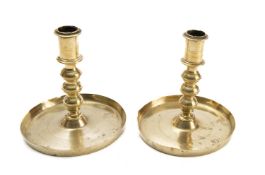 A pair of English brass candlesticks, first half 17th century,