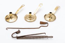 Three brass chambersticks,