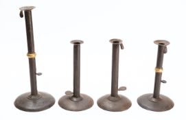 Two similar sheet iron 'hog scraper' ejector candlesticks,