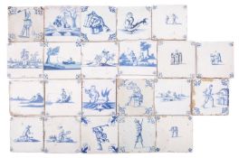 A group of twenty-two Dutch and English blue and white delftware tiles painted with figural