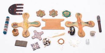 A collection of needlework and sewing accoutrements,