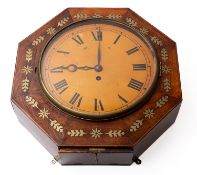 A Regency brass inlaid octagonal wall clock having an eight-day duration,
