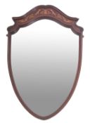 An Edwardian mahogany and marquetry framed wall mirror, early 20th century; shield shaped,