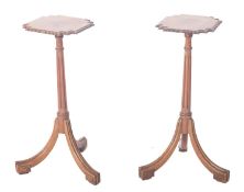 A pair of mahogany wine tables or candle stands in the Regency manner,