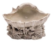 A Plymouth [William Cookworthy] shell salt: the shell resting on a rocky base applied with coral,