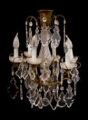 A gilt metal and glass hung six light chandelier, in Louis XV taste, by Baccarat,