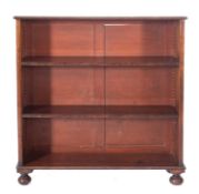 A late Regency mahogany low open bookcase, with reel turned mouldings,