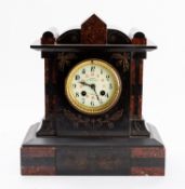 A decorative mid-Victorian French black slate and rouge marble mantel clock with an unusual 24-hour