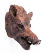 A 'Black Forest' carved and stained wood model of a boar's head, in the manner of a wall trophy,
