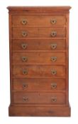 Maple & Co - A late 19th Century collectors walnut upright chest, the top with a bevelled edge,