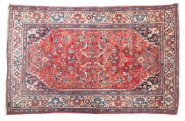 A Pakistan rug, the camel field with four central hexagonal panels with shaped medallions,