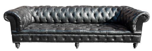A black faux leather button upholstered Chesterfield sofa, in Regency taste,