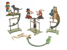 A group of Continental painted metal balance toys in Victorian style,
