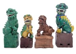 A group of four Chinese models of Buddhist lion dogs, 20th century,