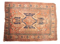 A Hamadan rug, the brick red field with a large central shaped cruciform medallion,