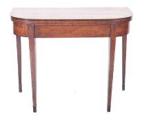 An early 19th Century mahogany and inlaid card table, of D shaped outline,