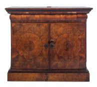 The upper section of an early 18th Century laburnum oyster veneer escritoire on a later plinth,