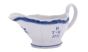 A documentary pearlware sauce boat, painted in blue with H and TM over 1773 and Tom & Mary verso,
