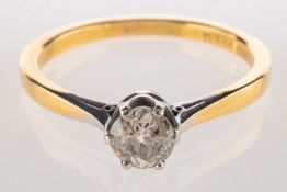 A diamond solitaire ring, set with a bri
