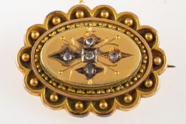 A gilt Victorian memorial brooch, set wi
