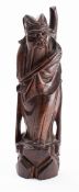 A Chinese carved and wire inlaid hardwood figure of an Immortal possibly Shou Lao,
