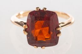 A garnet ring,