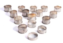A mixed group of sixteen silver napkin r
