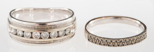 Two diamond set bands, including a gradu